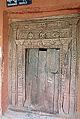 Ladakh - Alchi monastery, wooden carving of the Manjushri temple entrance 